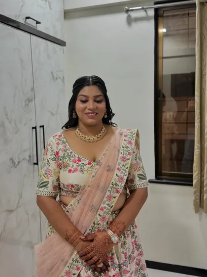 A happy and proud sister of the bride, looking her absolute best for the engagement ceremony.