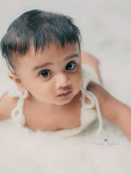 This little one is looking right at the camera, showing off his beautiful eyes and curious expression.