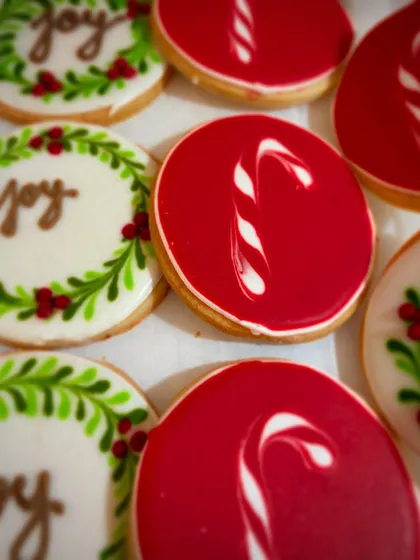 Spreading joy, one cookie at a time. Our hand-decorated Christmas sugar cookies feature festive designs like candy canes and holiday wreaths, making them almost too pretty to eat.