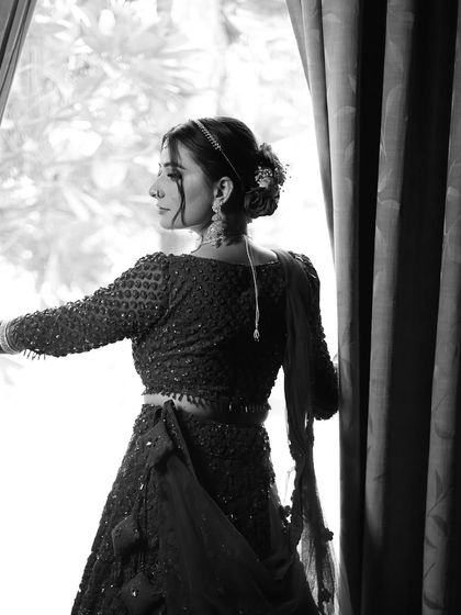 A timeless black and white portrait. This image captures the emotion and elegance of the moment, proving that a great makeup look is beautiful in any light.