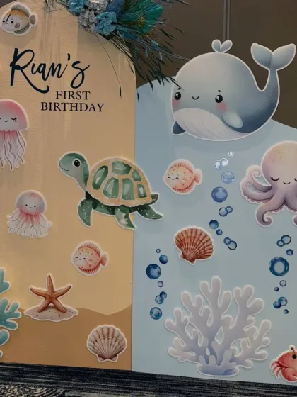A close-up of the right side of the underwater backdrop, featuring a cute whale, octopus, and crab.