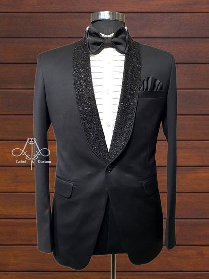 A classic black tuxedo with a sparkling lapel. This is a go-to choice for any formal event, ensuring you look sharp, stylish, and ready for the occasion.