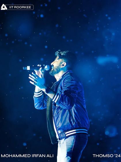 A stunning, atmospheric shot of Mohammed Irfan Ali performing at Thomso '24 under a shower of digital snow from our LED visuals.