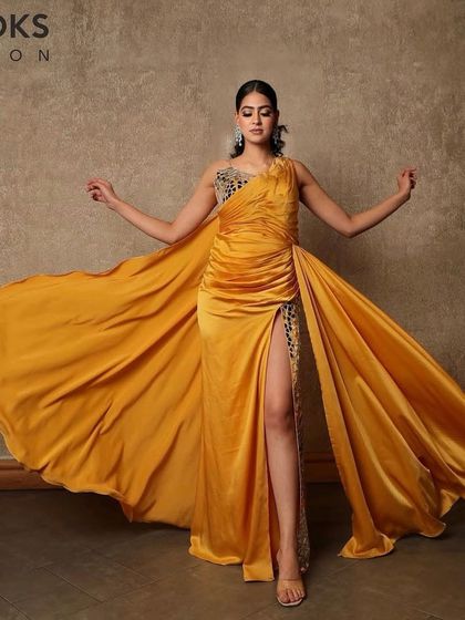 The full view of this stunning party ensemble. The makeup was designed to complement the dramatic yellow gown, with a focus on flawless skin and defined eyes that stand out.