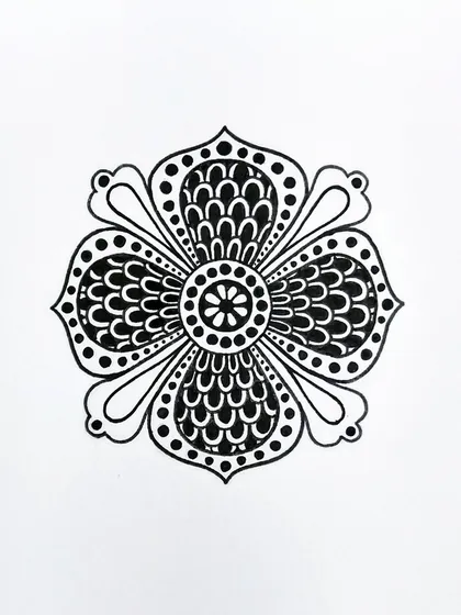 This floral motif uses repeating scallop patterns to create a sense of fullness. It's a simple yet elegant design, drawn entirely with black ink.
