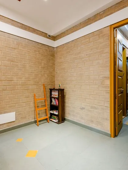 A different angle of the bedroom, showing the simple and functional furniture.