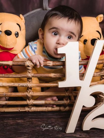 Celebrating six months with Winnie the Pooh! This half-birthday milestone shoot is a fun way to document your baby's growth.