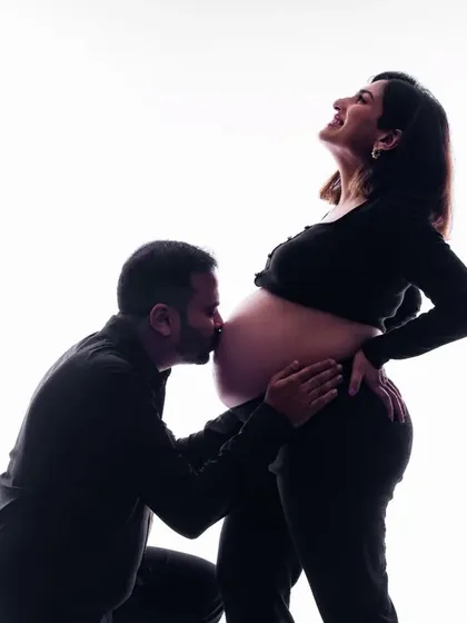 This is one of our favorite ways to capture the anticipation of pregnancy. A silhouette shot like this creates a timeless and artistic portrait, focusing on the beautiful bond between partners as they wait for their little one.
