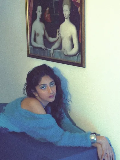 From muse to masterpiece. This shot, with a classic painting in the background, plays with the idea of art and beauty, using a modern, colorful makeup look in a classical setting.