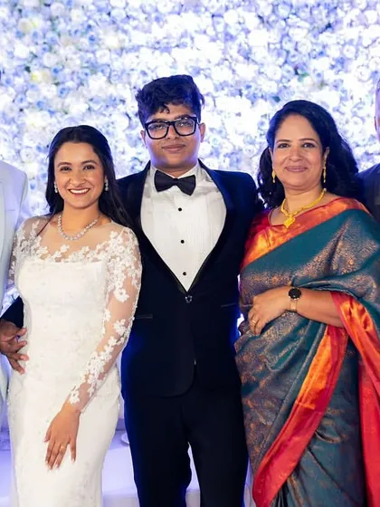 A beautiful family portrait from a Catholic wedding. The bride's makeup is soft, natural, and elegant, perfectly suited for her white lace gown.