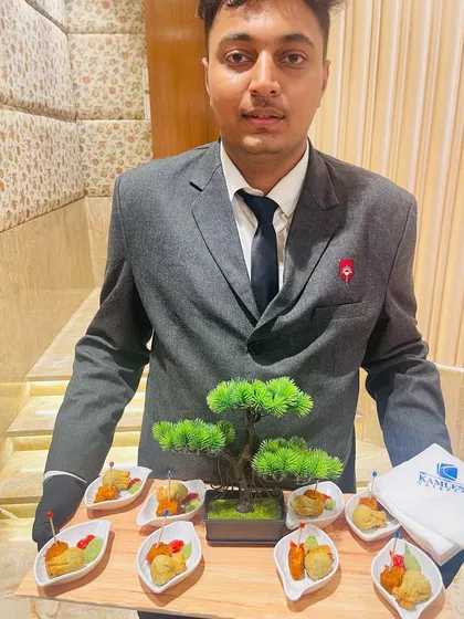 My professional staff ensures that even passed appetizers are served with elegance. This tray features a beautiful presentation with a bonsai tree centerpiece, reflecting my commitment to detail.