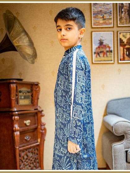 Another shot of our client in the blue printed kurta, looking thoughtful and stylish. It’s a versatile piece for any festive occasion.