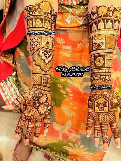 This design showcases a variety of traditional elements, including floral patterns, jharokhas, and geometric fills, creating a visually interesting piece.