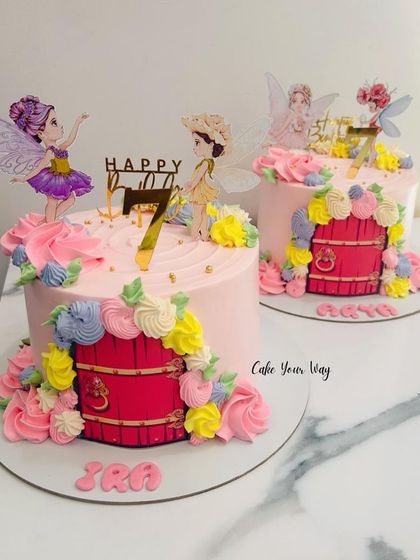 The two fairy door cakes together. It shows how I can create a cohesive theme while giving each cake its own unique personality.