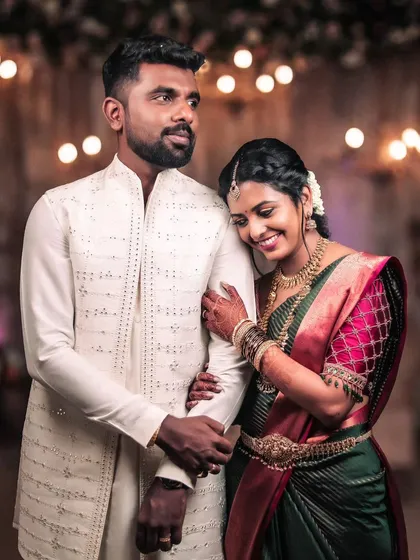 A classic South Indian wedding portrait that feels warm and genuine. The bride's gentle lean on her groom's shoulder tells a story of comfort and love. It’s these quiet, candid interactions that make the most beautiful memories.