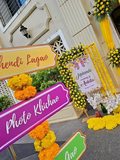 More of our custom Mehendi signage, with instructions like 'Mehendi Lagao' and 'Photo Khichao'. These small details help guide guests and add a personalized, interactive element to the event.