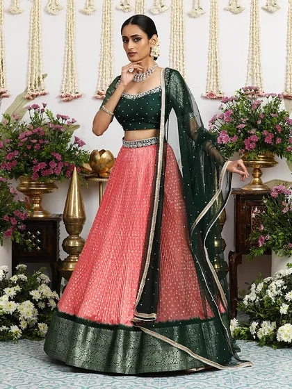 The full ensemble with the deep green dupatta, creating a dramatic and elegant look.