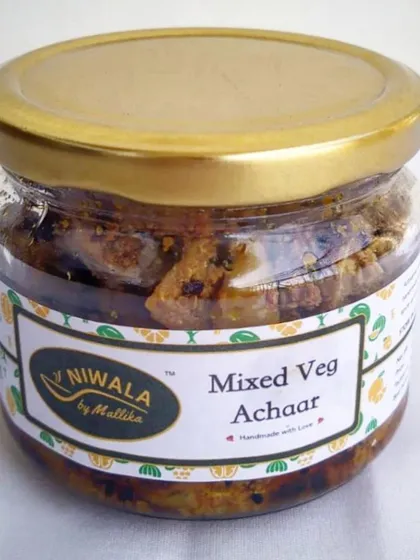 A jar of my sweet and savoury Mixed Veg Achaar. This pickle has a long shelf life and is packed with a medley of winter vegetables, ginger, garlic, and jaggery for a balanced flavour.
