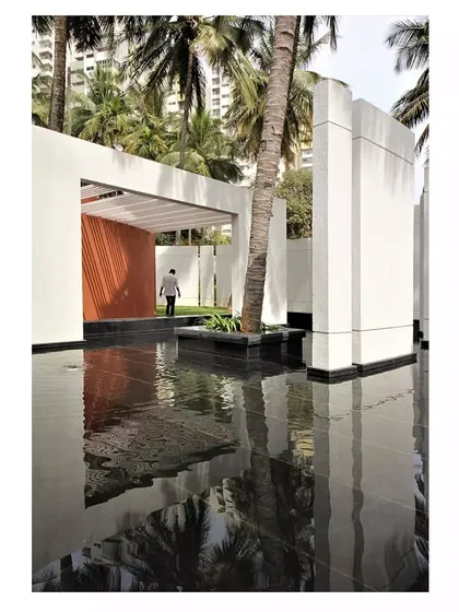 The design of the Akriti Experience Centre uses simple, solid forms and open passages to guide visitors through the space, with the water feature as a constant, calming presence.