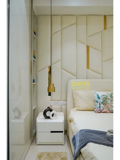 This close-up from the Tata LaVida master bedroom highlights the bedside table and the integrated shelving within the wardrobe unit. The design is seamless, maximizing storage while maintaining a clean aesthetic.