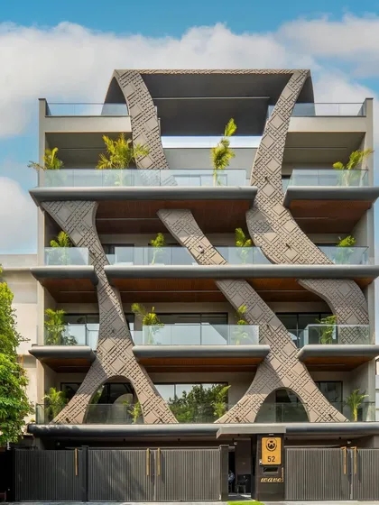Inspired by the fluidity of natural wave forms, this residential facade in Gurgaon showcases my passion for sculptural architecture. The design uses concrete grooving and a stone finish to create a dynamic, organic structure that is both a home and a piece of art.