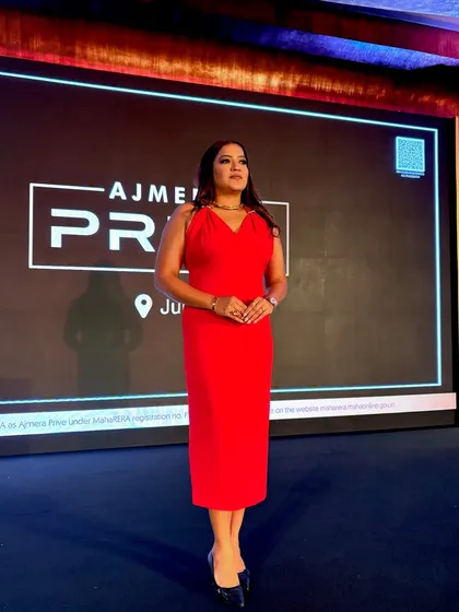 A powerful stance on the Ajmera Privé stage. For a luxury launch, the host's presence must match the brand's prestige.