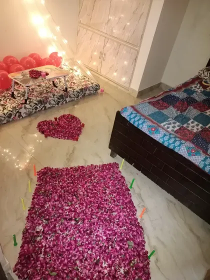 A wider view of the room, showing the rose petal pathway leading to the cabana. I created a large heart shape and a rectangular carpet effect using fresh rose petals on the floor.
