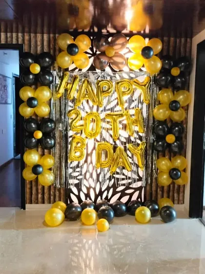 A duplicate image of the 20th birthday setup, showing the full effect of the black and yellow balloon flower theme. This design is great for making a statement in any space.