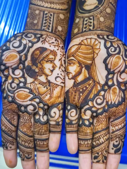 A close-up of the couple's portraits from my cousin's bridal mehendi. The negative space around the figures makes them stand out beautifully.