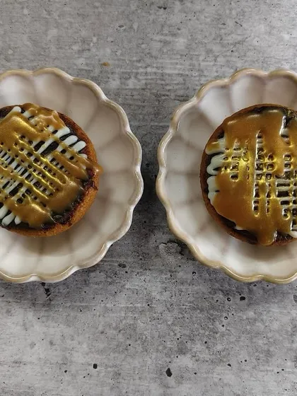 Golden cookie cups filled with molten salted caramel, because sometimes happiness fits right in the palm of your hand. A perfect two-bite treat.