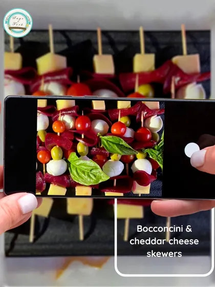 These Bocconcini and cheddar cheese skewers are a fun and easy-to-eat appetizer. Fresh basil, cherry tomatoes, and cheese make for a refreshing and colorful bite.