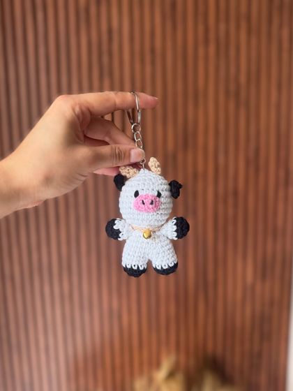 Moo-ve over, boring keychains. This little cow charm is utterly adorable and ready to come home with you.