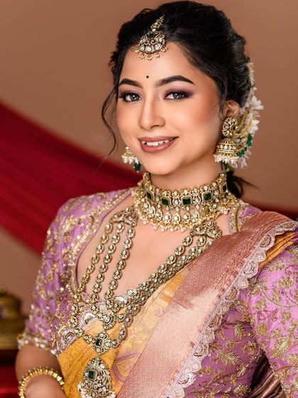 A happy and bright portrait of a bride. Her genuine smile and the vibrant colors of her outfit make this a lively and beautiful shot.