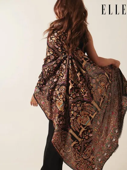 A beautiful, artistic shot from the back for the ELLE India editorial. Even from this angle, the polished finish of the hair and makeup is evident.