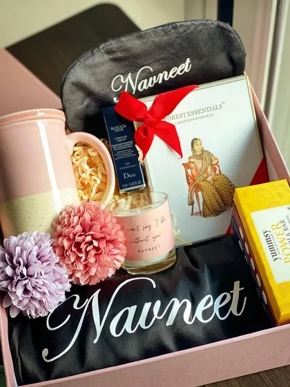 A truly special hamper for the Maid of Honor. This one includes luxury items like a Dior lip color and a Forest Essentials kit, alongside a personalized robe, eye mask, and custom candle.