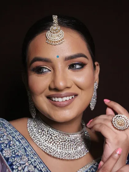 A happy, smiling shot that proves the makeup is not just beautiful but also comfortable to wear.