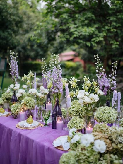 Another angle of the stunning floral tablescape, showing the variety of flowers and glassware.