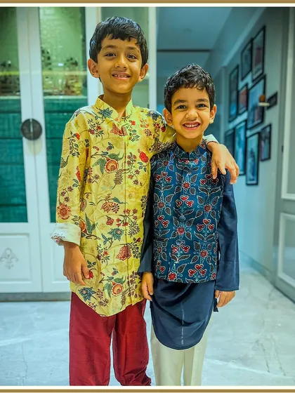 Two brothers, one stylish family. This photo captures a beautiful moment with our clients dressed in our printed kurta and Bundi set.