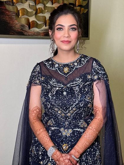 The final look is one of effortless style and sophistication. The makeup is natural yet glamorous, perfect for any party.