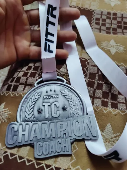 Champion Coach medal from Fittr. This is for my client's hard work and my passion for coaching. Results will speak.