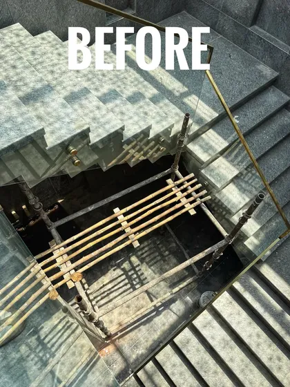 An overhead view of a stark, empty stairwell area that felt cold and industrial.