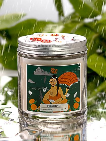 To truly capture the "Fresh Rain" theme, I shot this candle on a reflective surface with water droplets appearing to fall around it. This creates a cool, wet, and atmospheric mood.