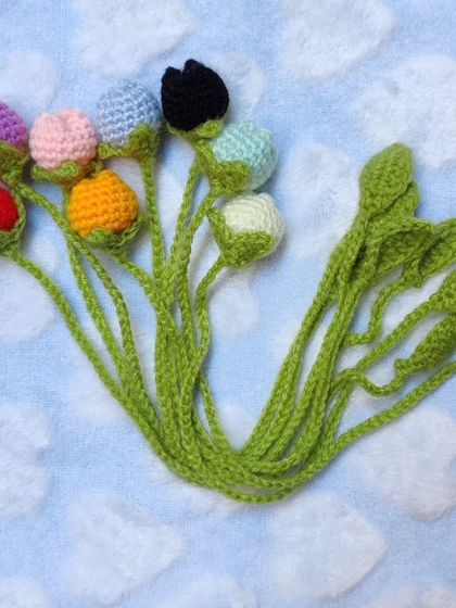 A collection of eight different colored tulip bookmarks.