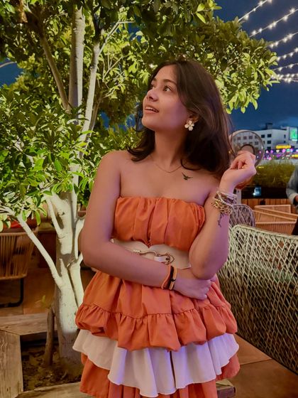 Felt cute, might change my name to Cecilia. This tiered orange and white dress has such a fun, playful vibe.