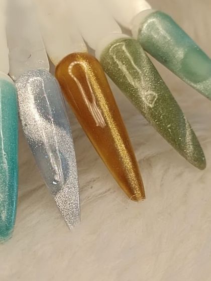 A fun and colorful selection of my green, blue, and gold cat eye polish swatches.