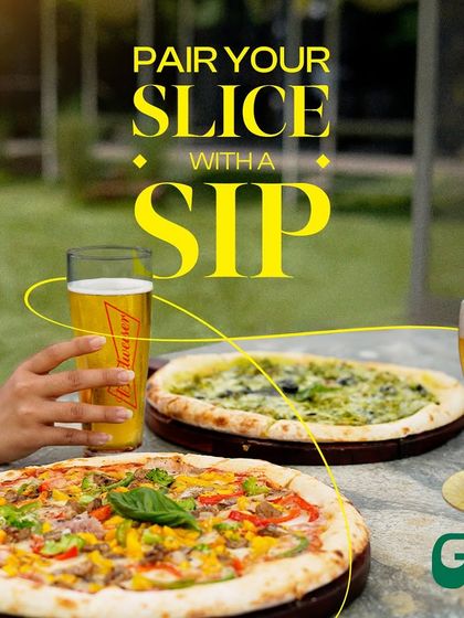 Pair your slice of pizza with a sip of cold beer for the ultimate comfort meal.