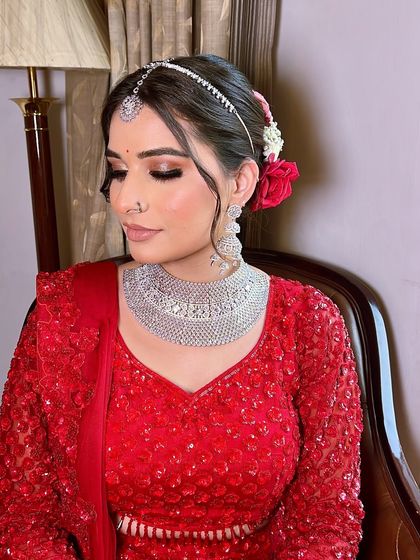 My bride Anjali looking serene and beautiful. We opted for a soft glam look with a diamond necklace, which is a modern and elegant choice for a wedding day.