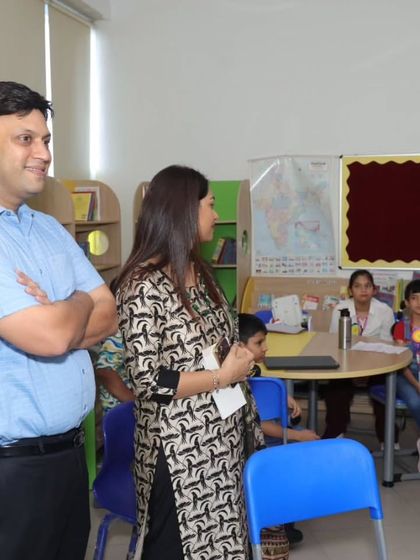 Our Chairman and First Lady observe a classroom activity during the 'Carpe Diem' event, showing their support for our students' literary pursuits.