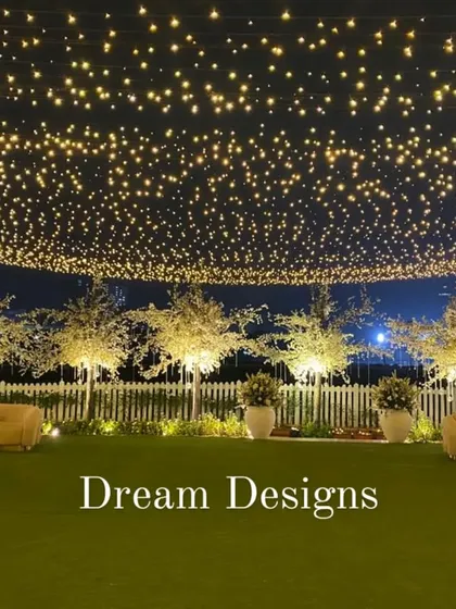 Lighting is essential for setting the mood. I created this enchanting canopy of thousands of fairy lights to transform an outdoor space into a starlit wonderland, providing a warm and magical glow for the entire evening.