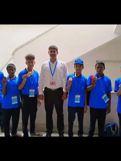 Standing with some of our medal-winning junior boxers. As their coach, seeing them achieve their goals is the greatest reward.